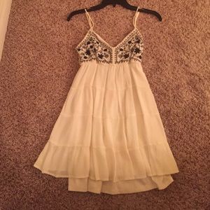 Cream sundress with navy blue embroidery at top