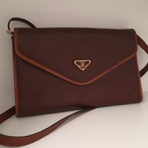 Cognac brown leather messenger bag.