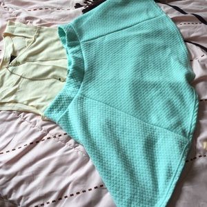 Short light blue-green skater skirt.