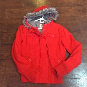 Warm bright red jacket.