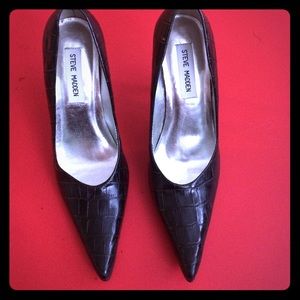 Black leather pumps