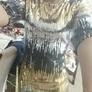 Black gold and silver sequined dress