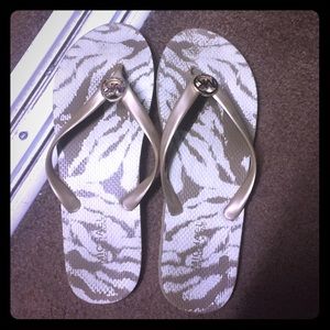 Michael Kors flip flops in gold/cream