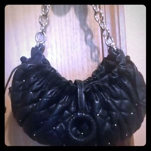 Bcbgmaxazria black leather clutch with gold studs