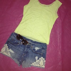 Distressed denim shorts with added appliqué