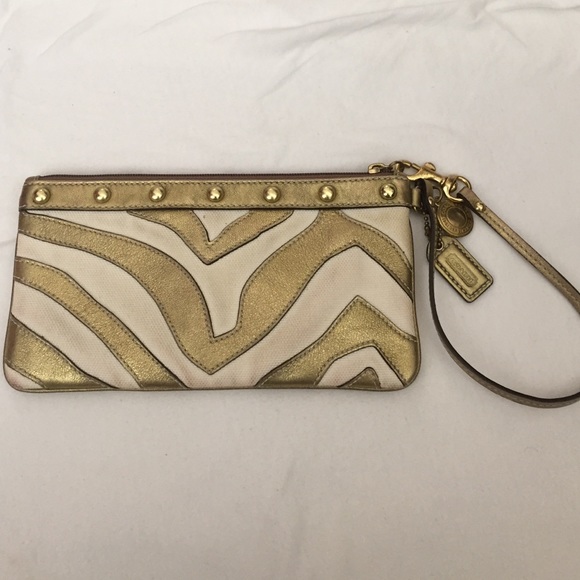 SOLD-----Coach wrist bag , color gold/cream