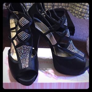 Black satin platform peep toe pumps