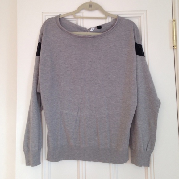 Grey sweater with lace on sleeves and button back