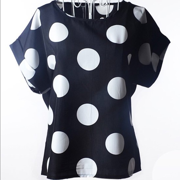 Polkadotted blouse.