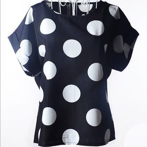 Polkadotted blouse.