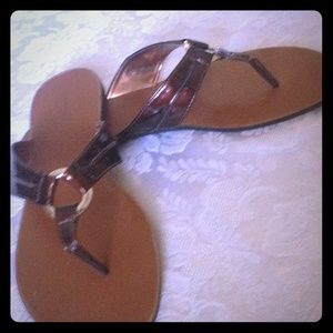 Warm brown and gold flip flops