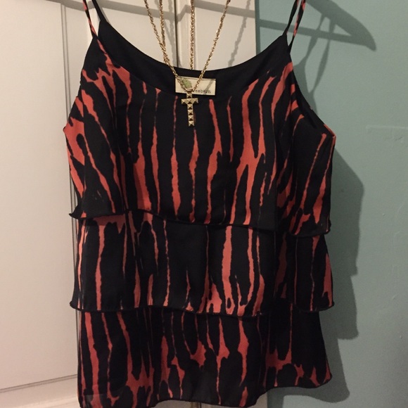 Silky black with orange stripes tank.