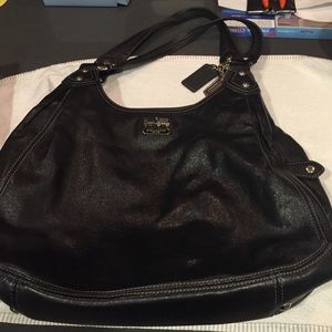 Coach black leather purse with three compartments.