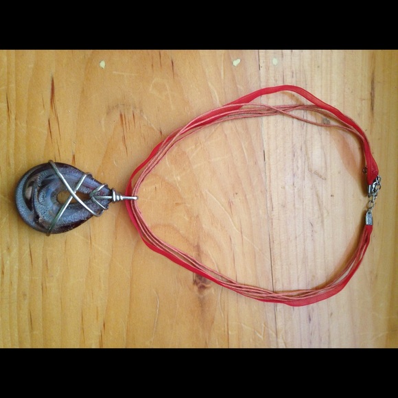 Handmade necklace has gem w multi color swirls