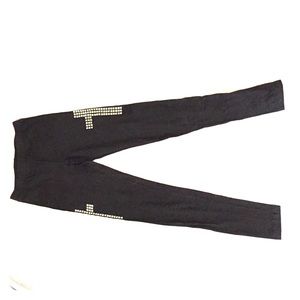 Black leggings with studded crosses