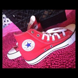 Red high top Chuck Taylor's