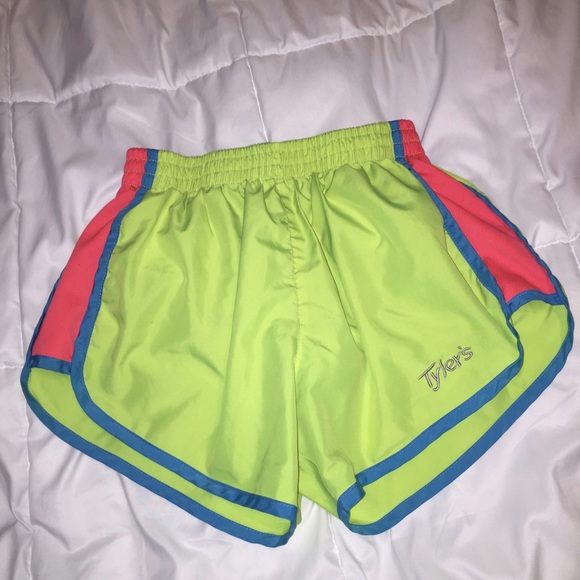 Tyler's yellow, pink, and blue athletic shorts