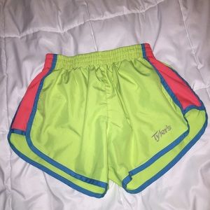 Tyler's yellow, pink, and blue athletic shorts