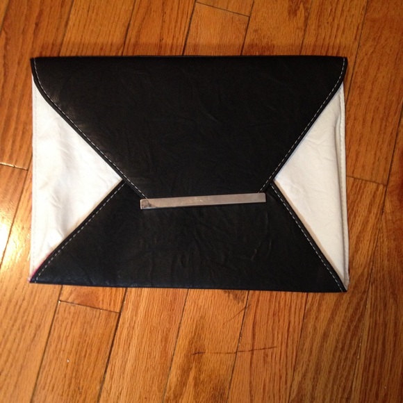 Envelope clutch with pink polkadot interior