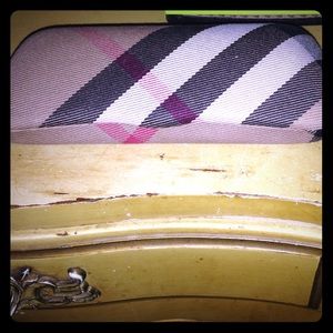 Tan, brown, red, and white glasses case!