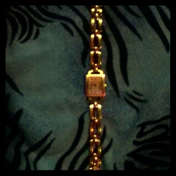 I AM selling a Herbelin.gold-tone bracelet watch