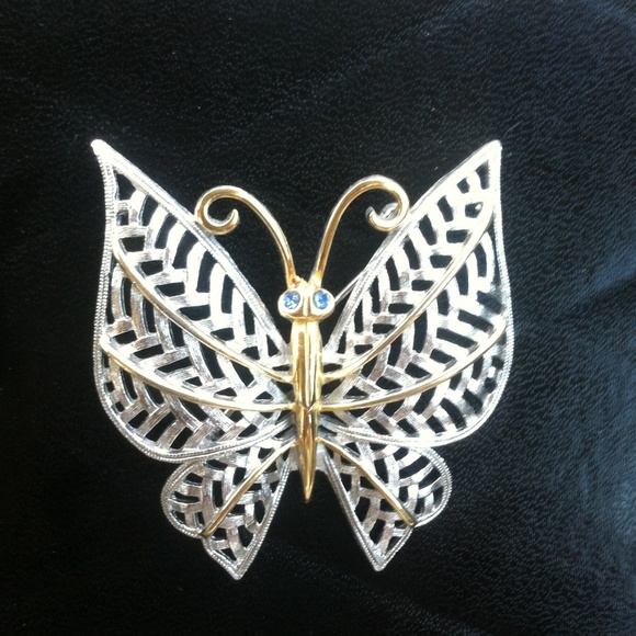 Silver and golden tone metal butterfly brooch