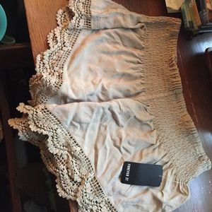 Taupe colored woven shorts with lace trim