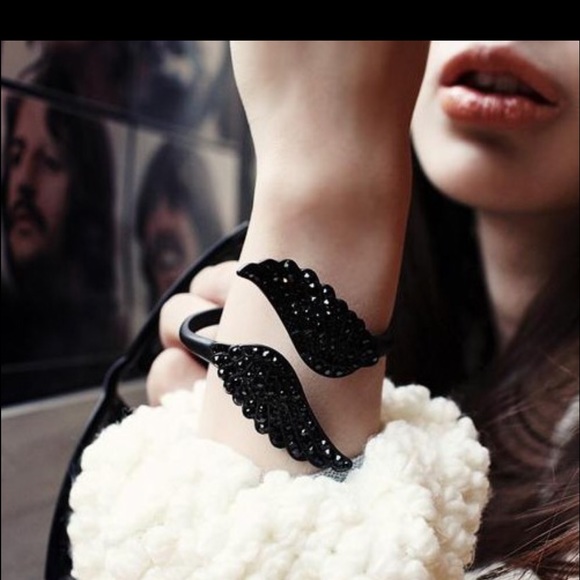 Black bracelet with silver crystal.