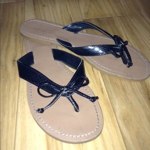 Tan And Black Flip Flops