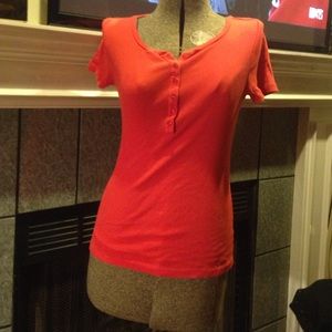 A red buttoned shirt