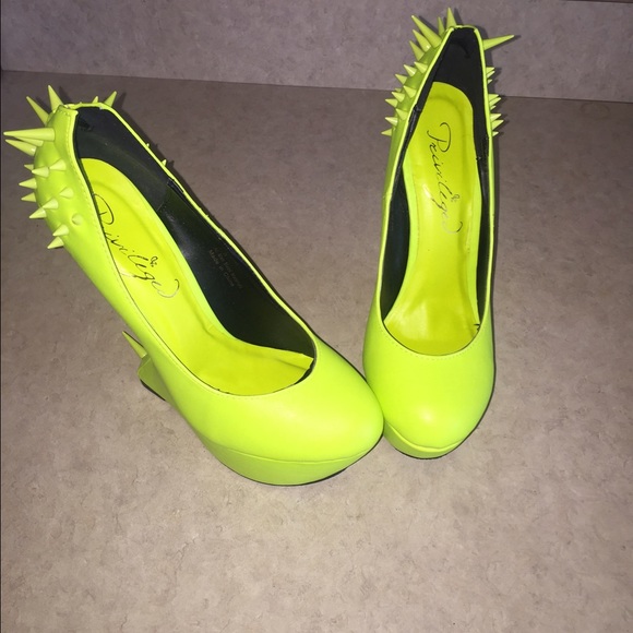Neon green wedge high heel shoe.