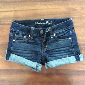 American Eagle dark wash denim shorts.