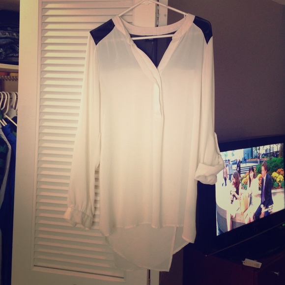 White and black shirt.