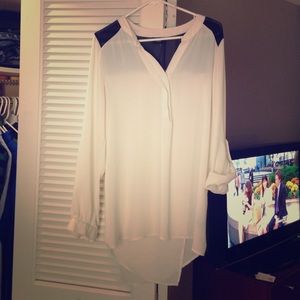 White and black shirt.