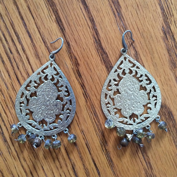 Gold ornate earrings with green beads