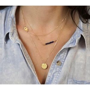 Multi-layered gold tone necklace