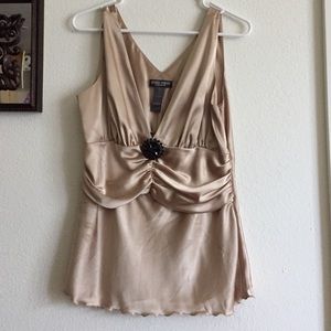 Gold Bisou Bisou blouse with black pendant