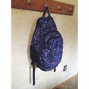 Purple Nike Backpack with a Orange Swoosh