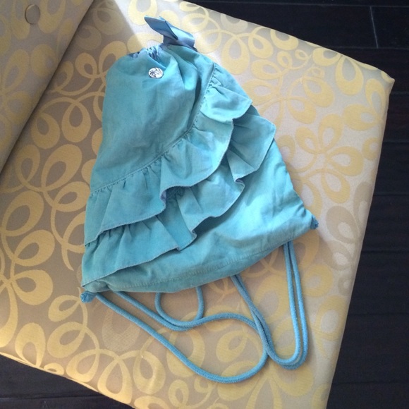 Ruffle now drawstring bag with button