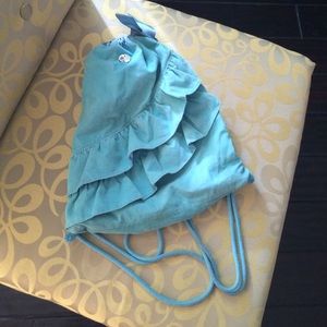 Ruffle now drawstring bag with button