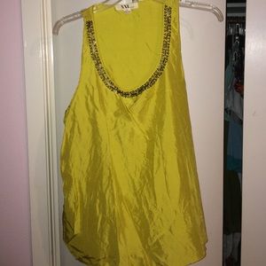 Yellow shiny sleeveless blouse with embellishment