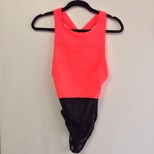 Bright peachy leotard.