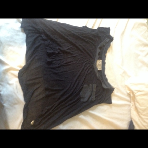 Black shirt with lighter trim shorter in front