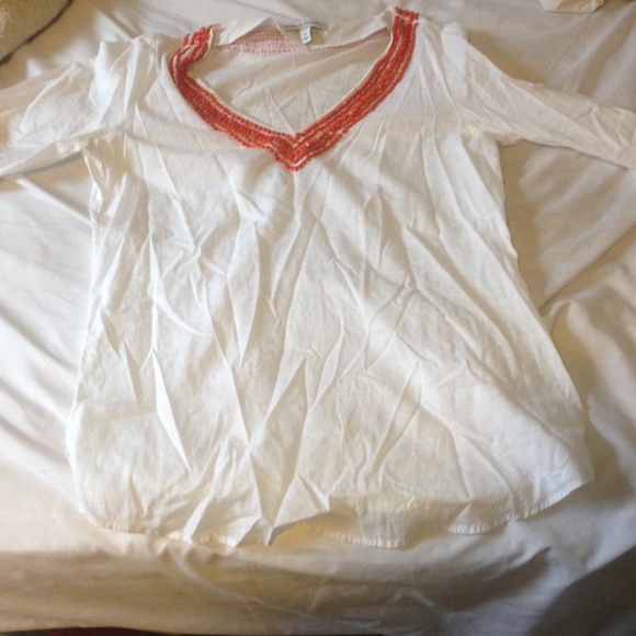 Three quarter white sleeve top orange beads on top