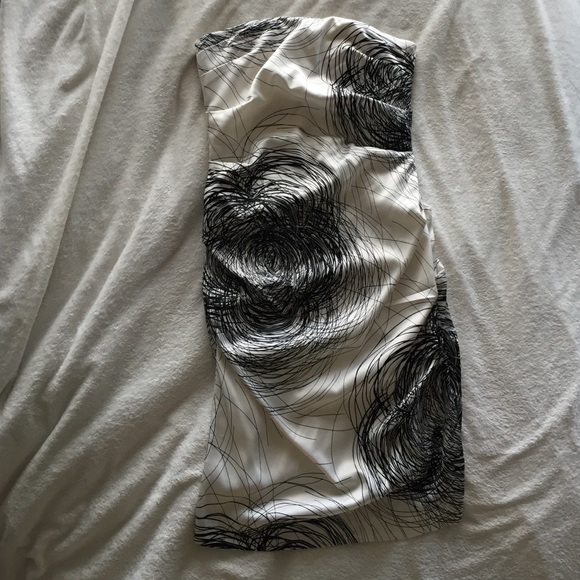 White and black satin-like strapless dress