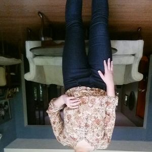 Flowy sheer brown floral shirt.