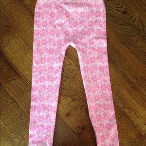 Girl's pink and white floral tights