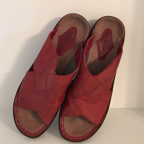 Red Clarks slip on shoes.