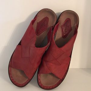Red Clarks slip on shoes.