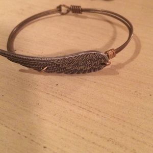 Silver eagle wing with bronze band